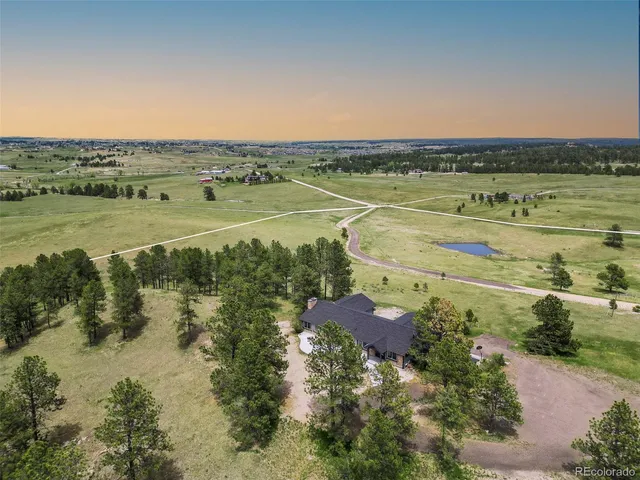 a view of a green field with clear sky