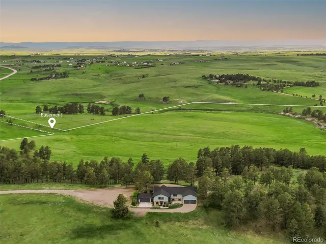 a view of a swimming pool with a garden