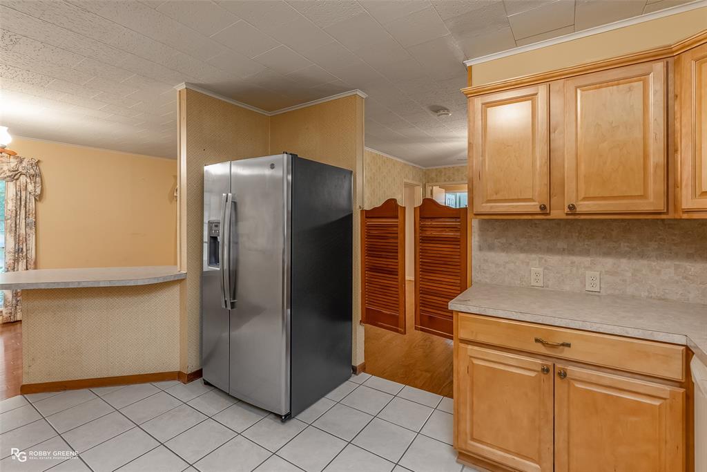 407 Fincher Road Minden, LA 71055 - Photo 16 of 28 a kitchen with stainless steel appliances granite countertop a refrigerator and a stove