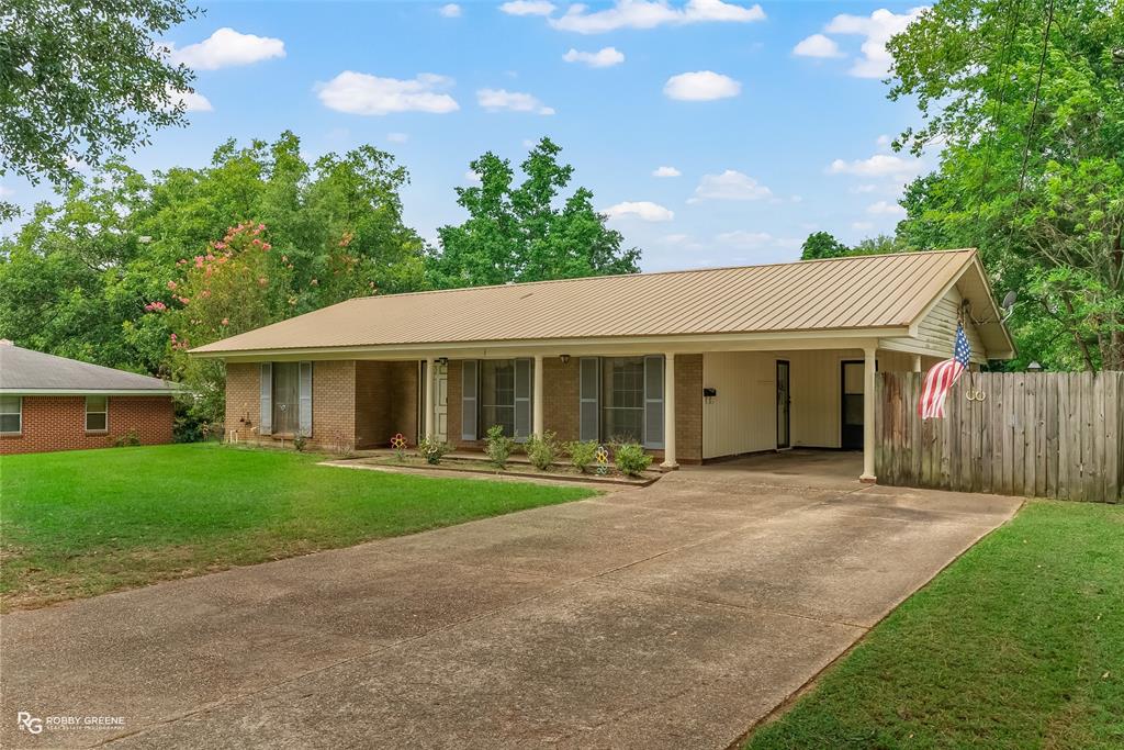 407 Fincher Road Minden, LA 71055 - Photo 2 of 28 a front view of a house with a yard and porch