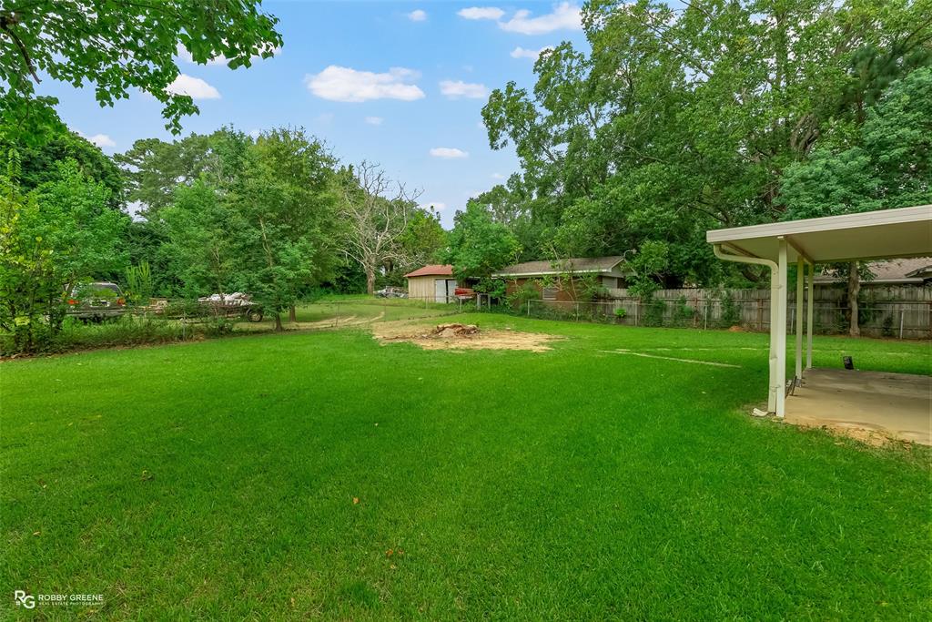 407 Fincher Road Minden, LA 71055 - Photo 25 of 28 a view of a park with plants and large trees