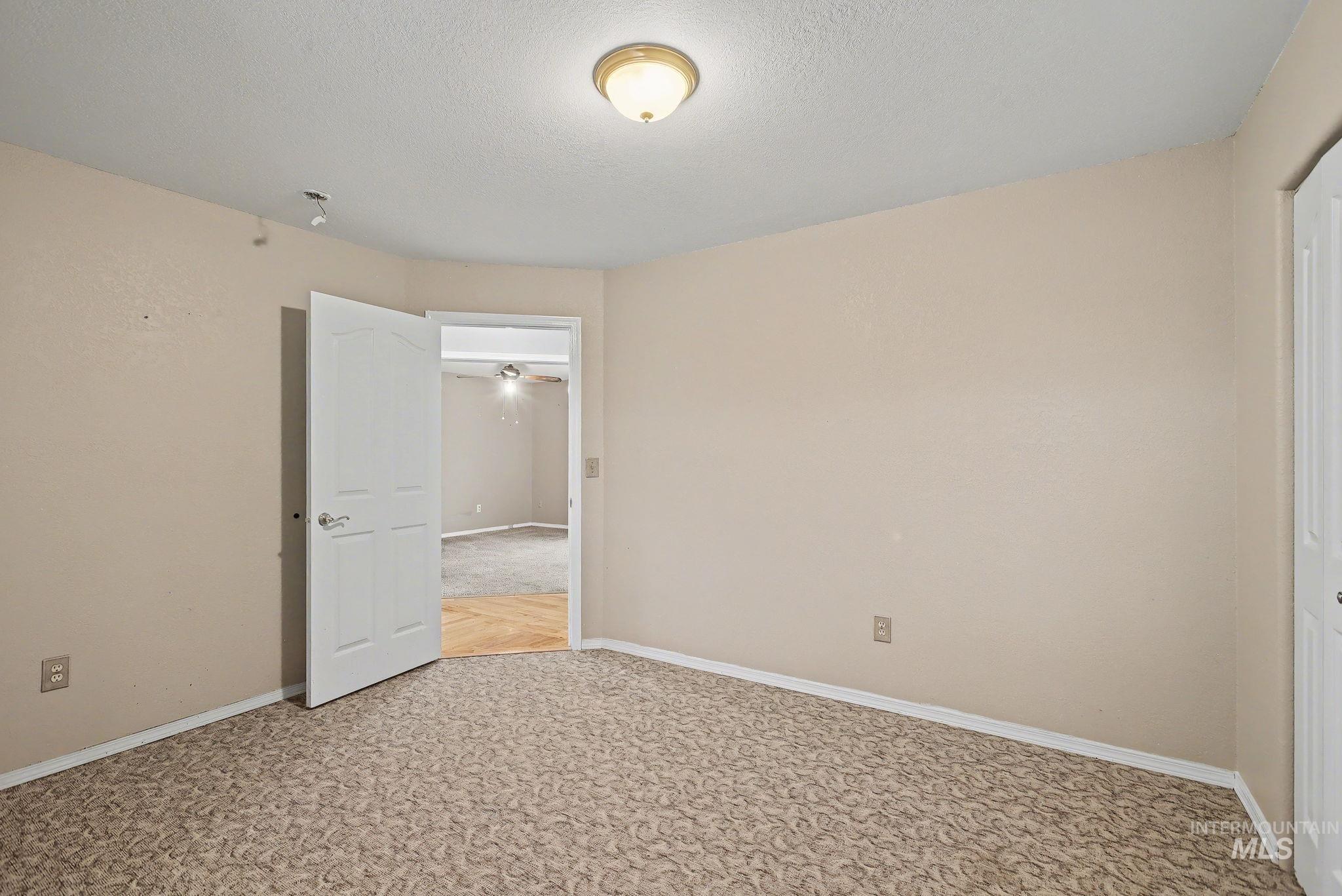 2242 Chukar Lane Clarkston, WA 99403 - Photo 27 of 41 Unfurnished room with a textured ceiling and light carpet