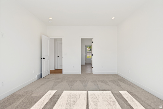 1351 Maple Circle Santaquin, UT 84655 - Photo 18 of 42 Spacious room featuring light-toned carpeting and bright white walls