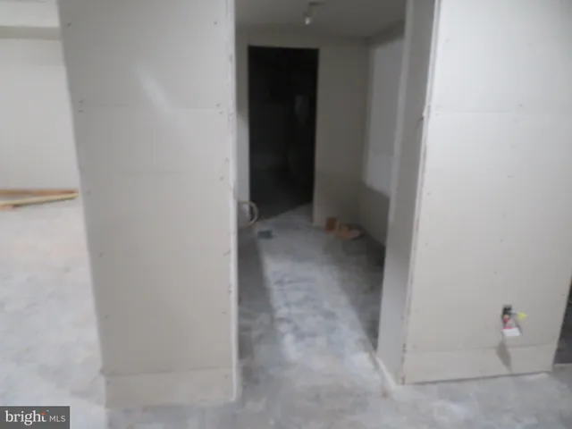 a bathroom with a bathtub sink and cabinets