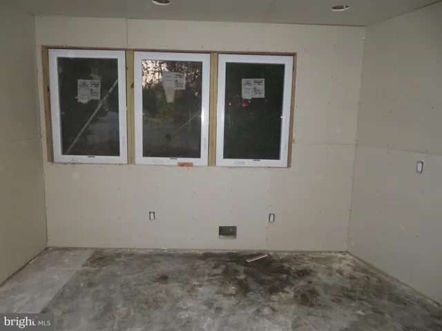 an empty room with an entryway door