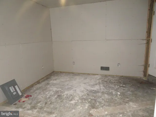 a view of empty room with windows