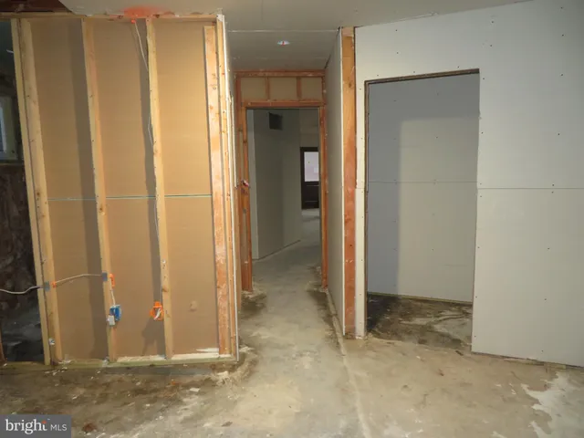 a view of an empty room with a fireplace