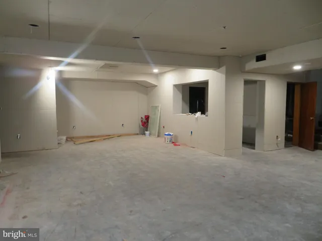 a view of garage with flat screen tv