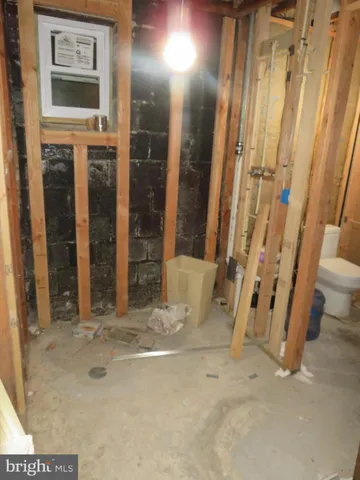a white toilet sitting next to a sink