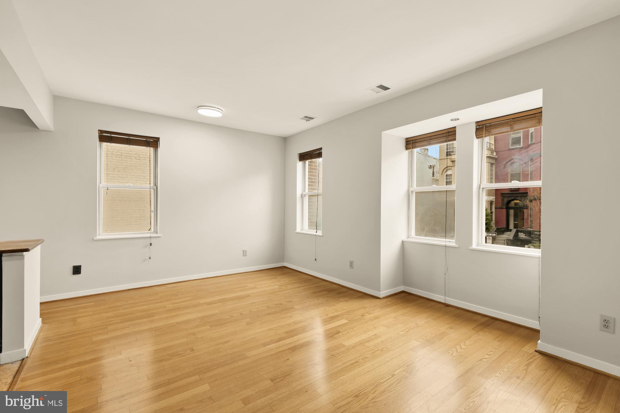 2114 N Street Northwest, Unit 11 Washington, DC 20037 - Photo 5 of 20 a view of an empty room with a window