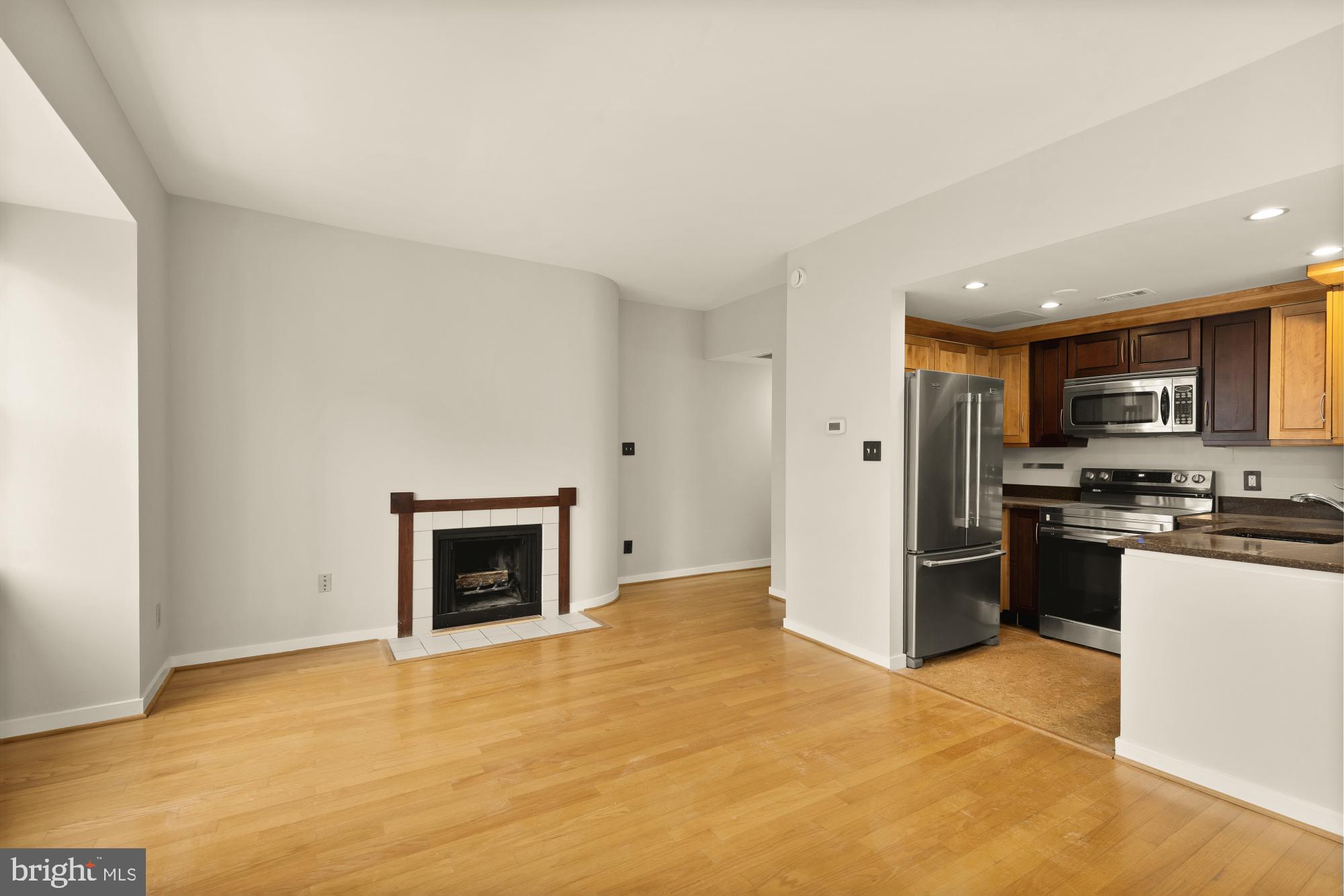 2114 N Street Northwest, Unit 11 Washington, DC 20037 - Photo 8 of 20 a view of a kitchen with a sink and a stove top oven