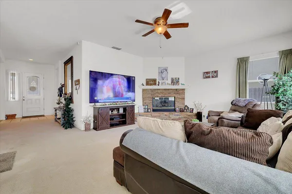 a living room with furniture and a fireplace