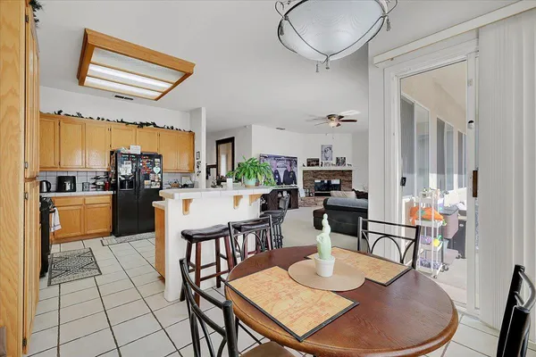 a large white kitchen with cabinets a sink and a counter top space