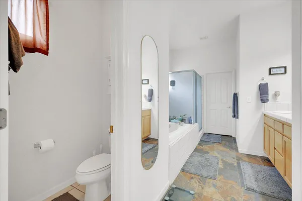 a building outdoor space with patio furniture and potted plants