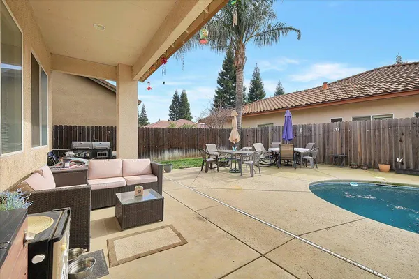 a view of a swimming pool with a patio