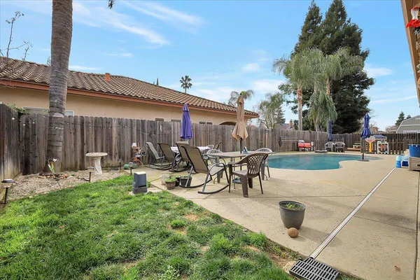 a view of swimming pool with outdoor seating
