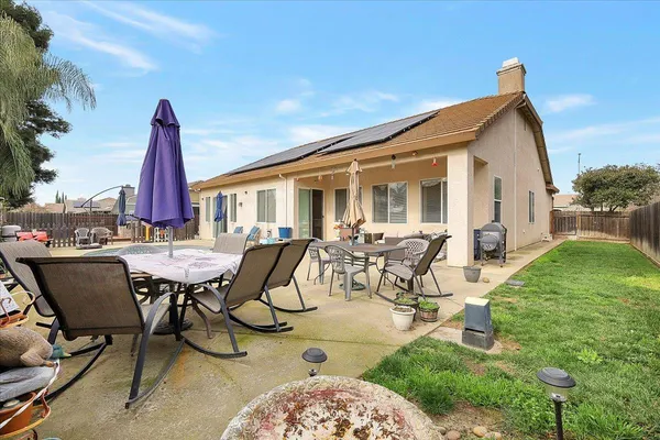 a view of swimming pool with outdoor seating and city view