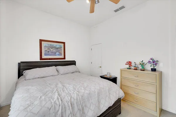 a bathroom with a sink vanity granite and toilet