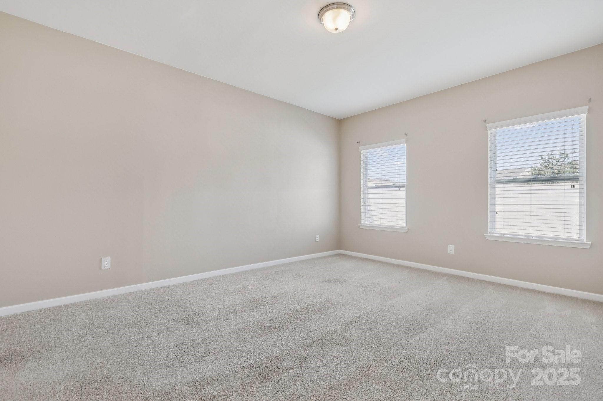 2822 Hopeton Court Monroe, NC 28110 - Photo 22 of 28 an empty room with windows