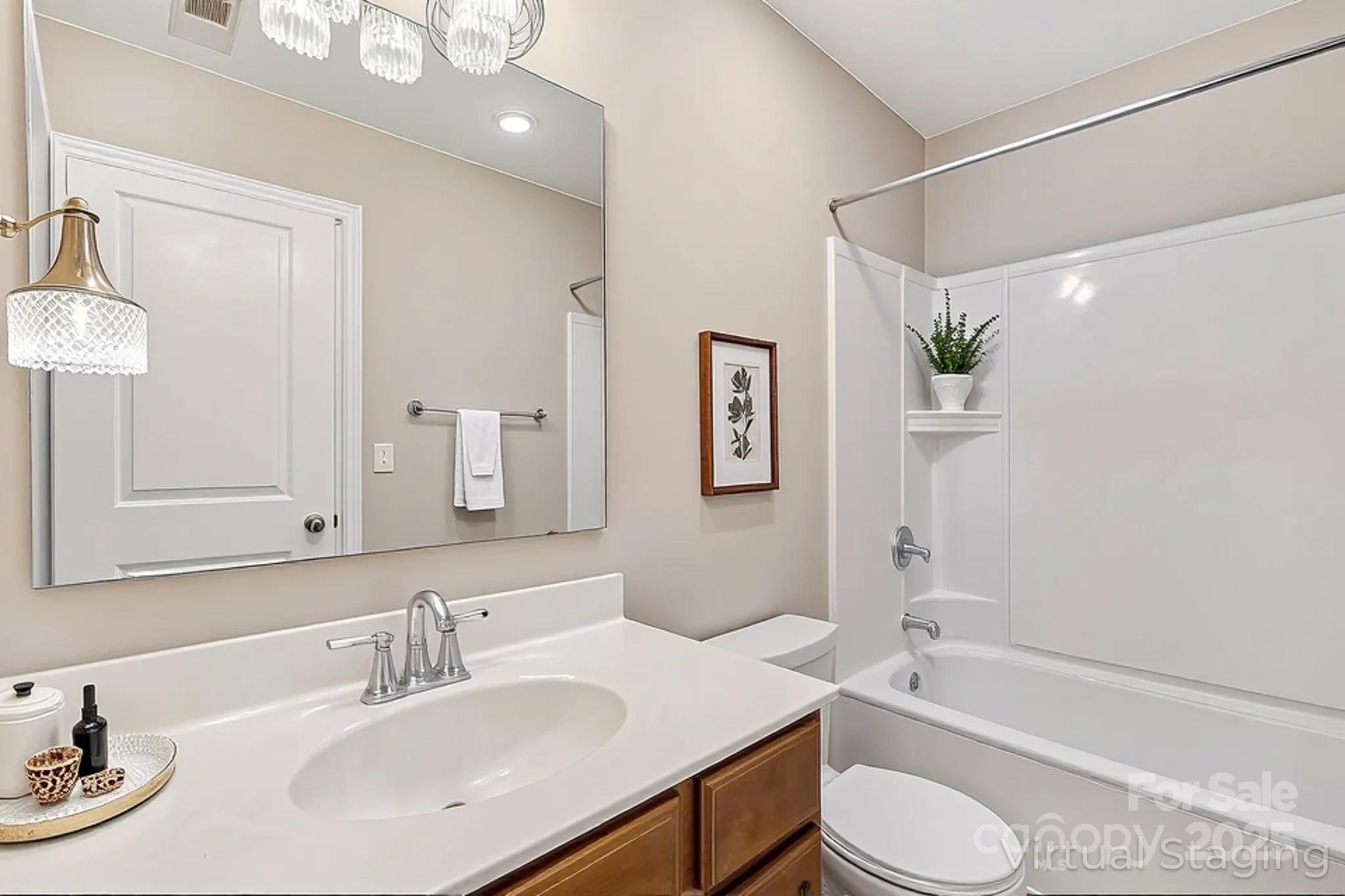 2822 Hopeton Court Monroe, NC 28110 - Photo 23 of 28 a bathroom with a sink toilet tub and shower