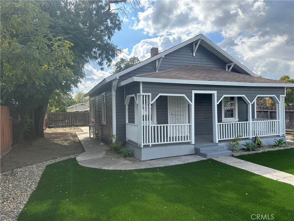 4 West 13th Street Merced, CA 95341 - Photo 4 of 23 a front view of a house with a yard