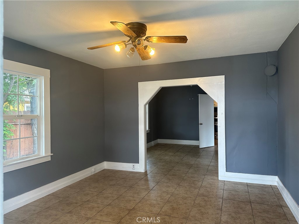 4 West 13th Street Merced, CA 95341 - Photo 6 of 23 an empty room with closet and chandelier fan