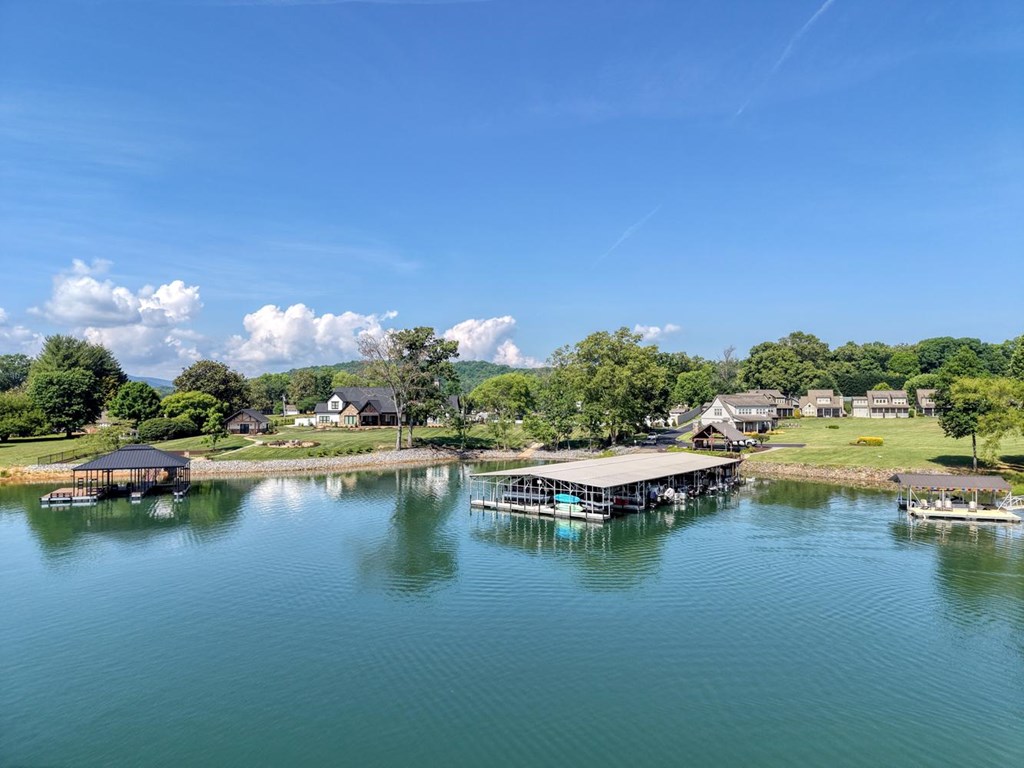 31 Elf School Road Hayesville, NC 28904 - Photo 6 of 59 a view of a lake with boats and trees in the background