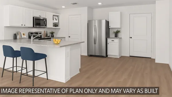 a kitchen with stainless steel appliances a refrigerator and a sink