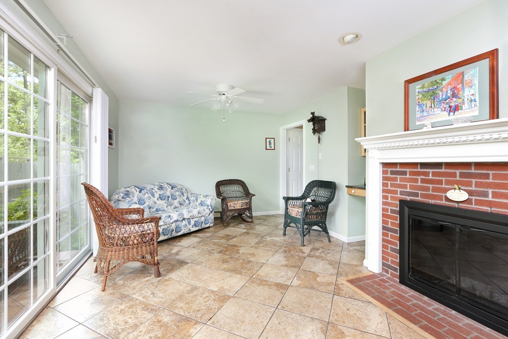 237 Valley Road Plymouth, MA 02360 - Photo 7 of 25 a living room with furniture and a fireplace