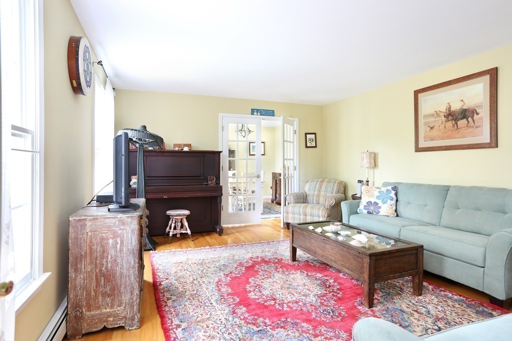 237 Valley Road Plymouth, MA 02360 - Photo 8 of 25 a living room with furniture and a fireplace