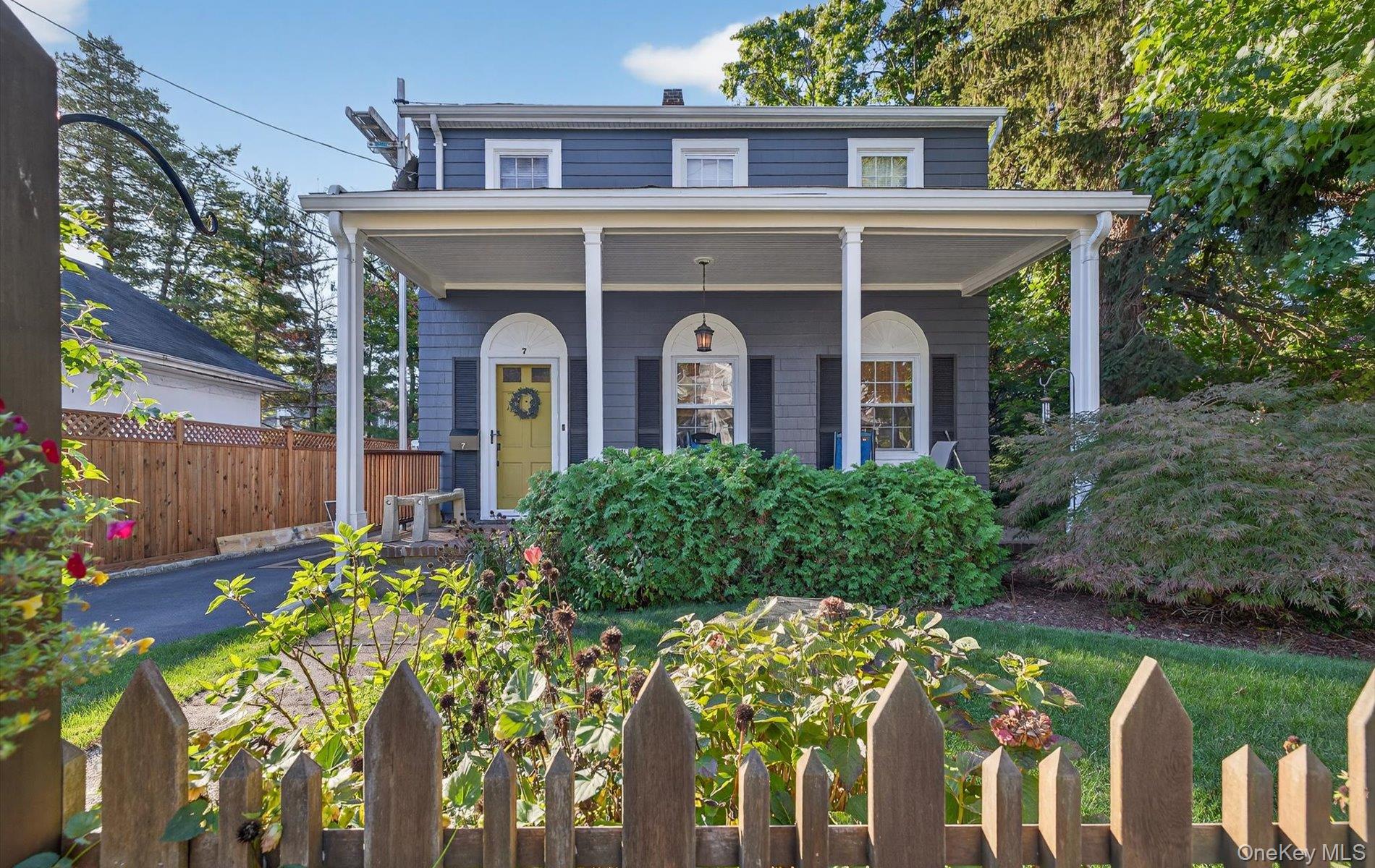 front view of a house with a garden