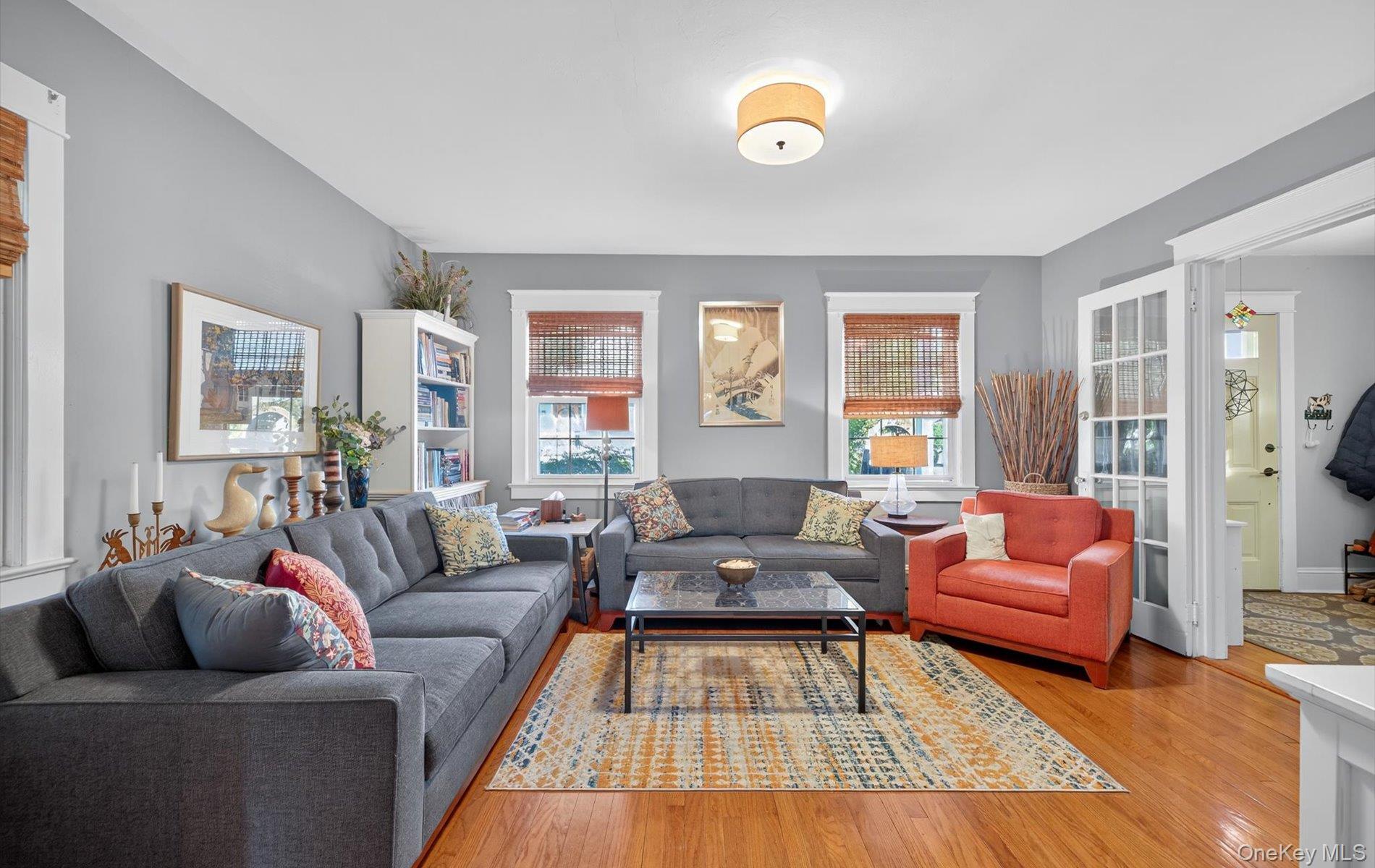 7 Ransom Avenue Sea Cliff, NY 11579 - Photo 11 of 42 a living room with furniture and a large window