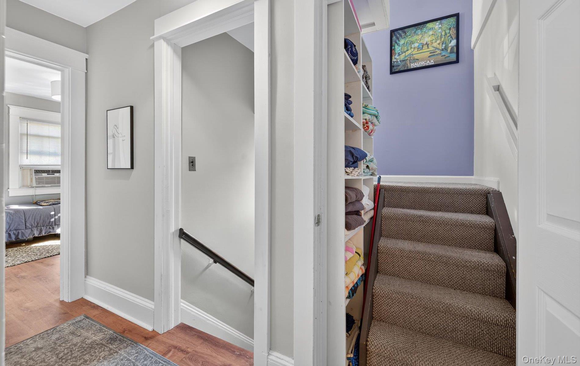 7 Ransom Avenue Sea Cliff, NY 11579 - Photo 31 of 42 a view of hallway with stairs and wooden floor