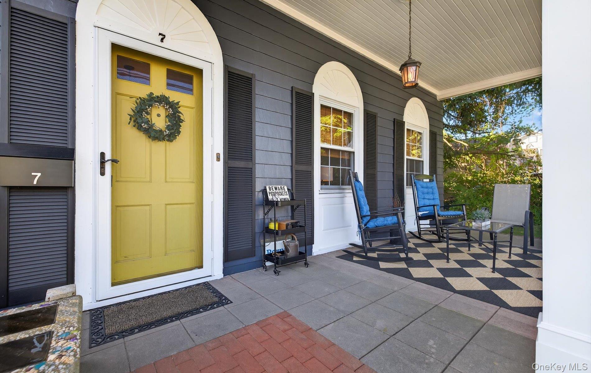 7 Ransom Avenue Sea Cliff, NY 11579 - Photo 5 of 42 a front view of a house with a porch