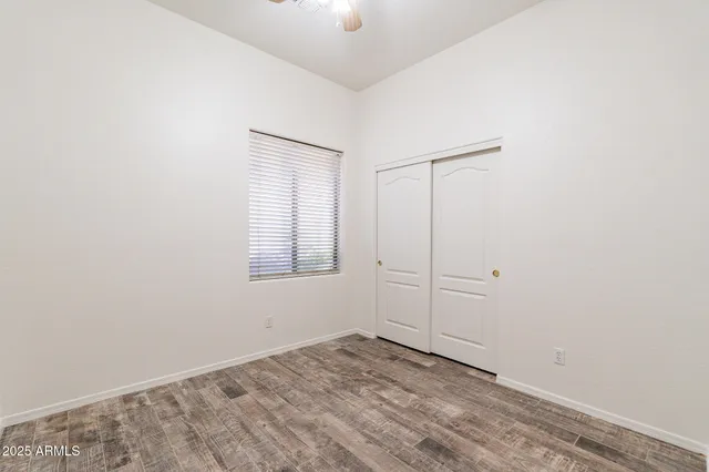 an empty room with a empty space and windows