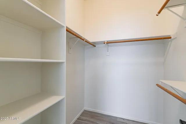 a view of an empty walk in closet