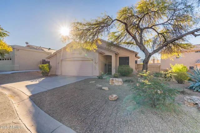 a front view of a house with yard