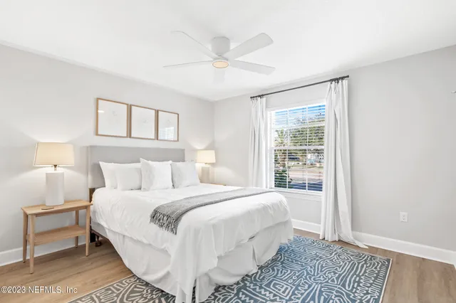 a bedroom with a large bed and a window