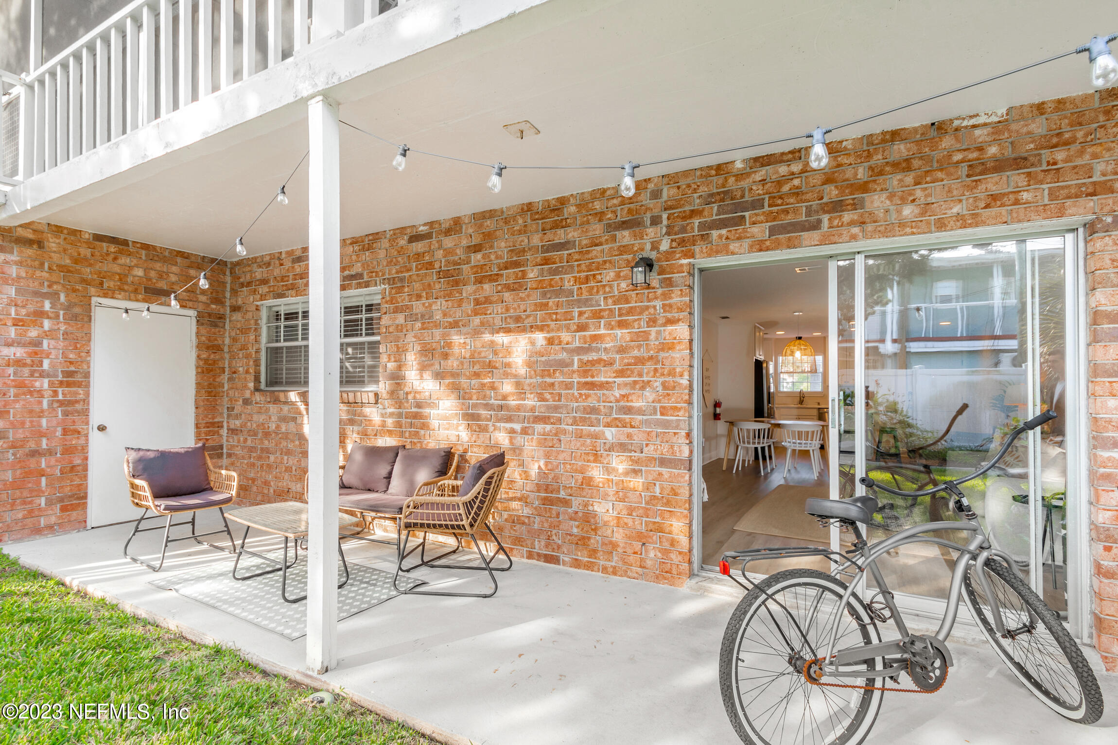 405 Flagler Boulevard, Unit 2A St. Augustine, FL 32080 - Photo 21 of 30 a building outdoor space with patio furniture and potted plants