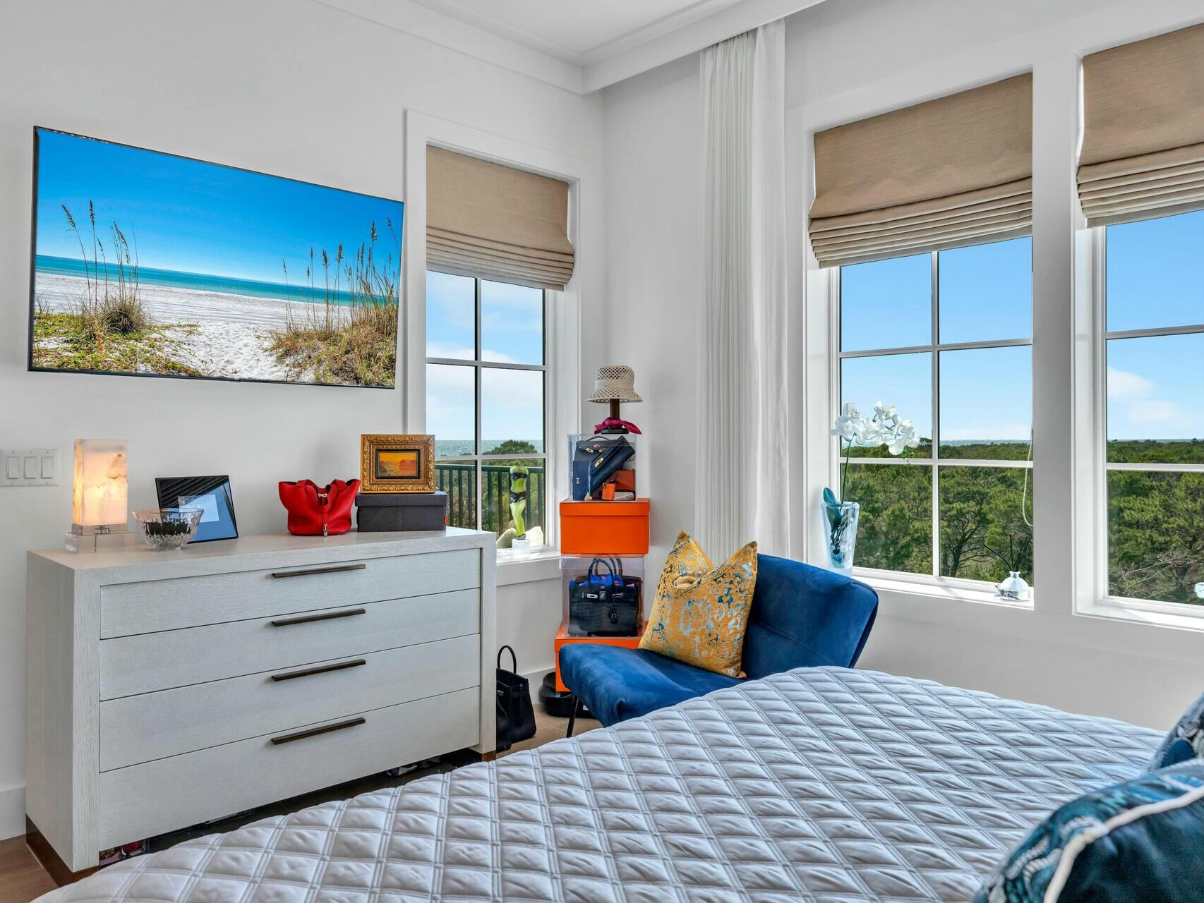 206 Henderson Resort Way, Unit 5202 Destin, FL 32541 - Photo 19 of 55 a bedroom with a bed and wooden floor