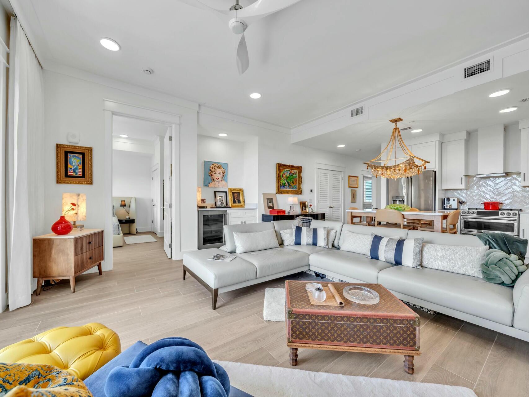 206 Henderson Resort Way, Unit 5202 Destin, FL 32541 - Photo 2 of 55 a living room with furniture or kitchen and a chandelier