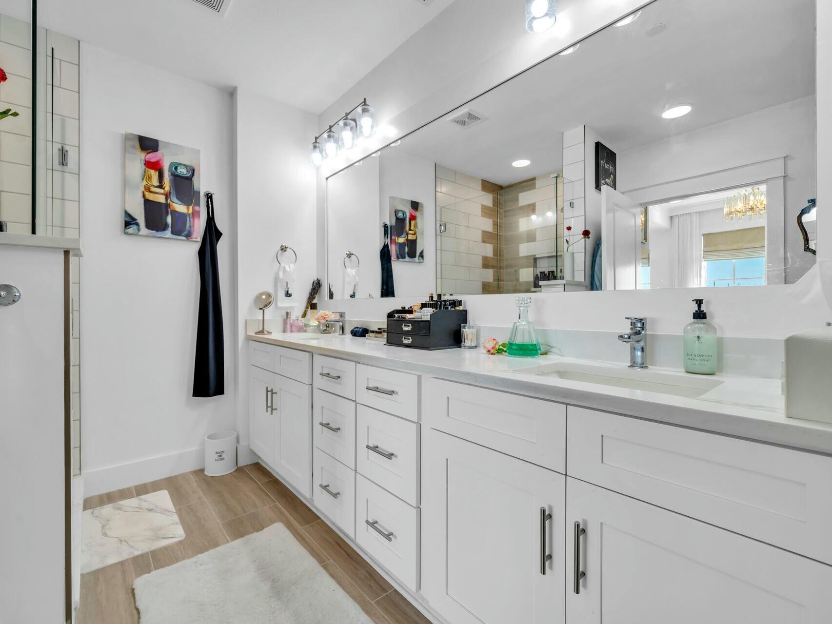 206 Henderson Resort Way, Unit 5202 Destin, FL 32541 - Photo 22 of 55 a bathroom with a sink double vanity and shower
