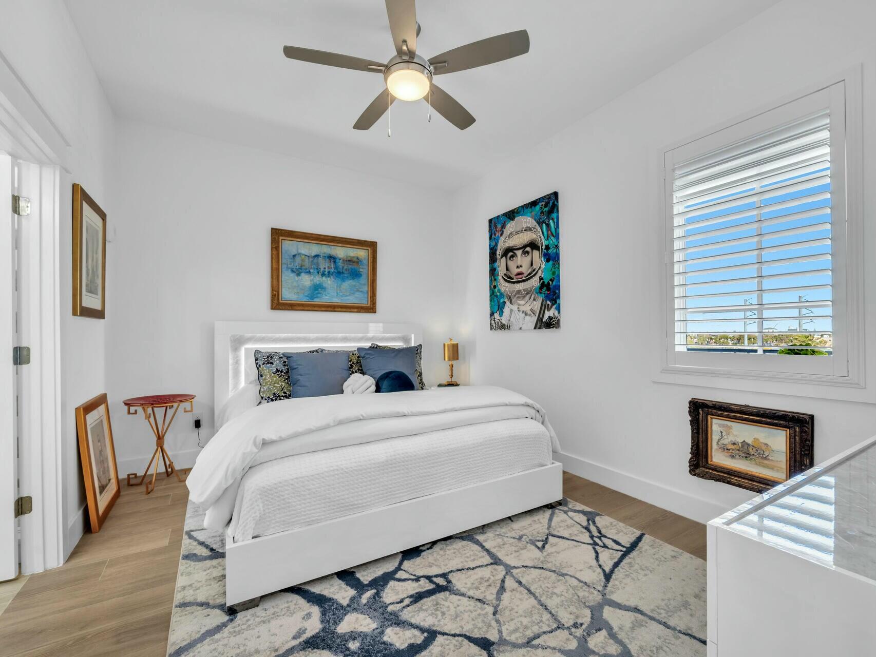 206 Henderson Resort Way, Unit 5202 Destin, FL 32541 - Photo 25 of 55 a bedroom with a bed dresser and a window