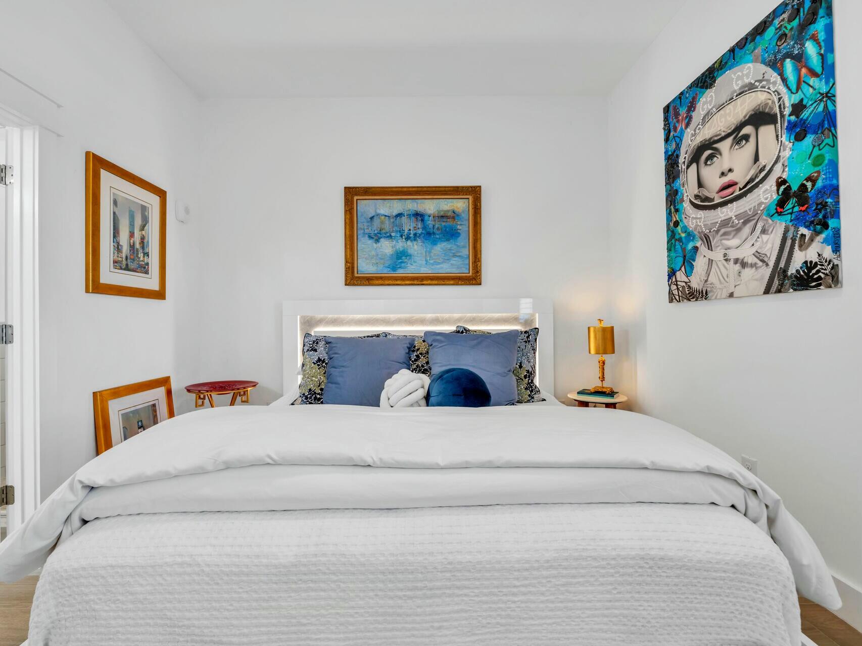 206 Henderson Resort Way, Unit 5202 Destin, FL 32541 - Photo 26 of 55 a bedroom with a bed and painting on the wall