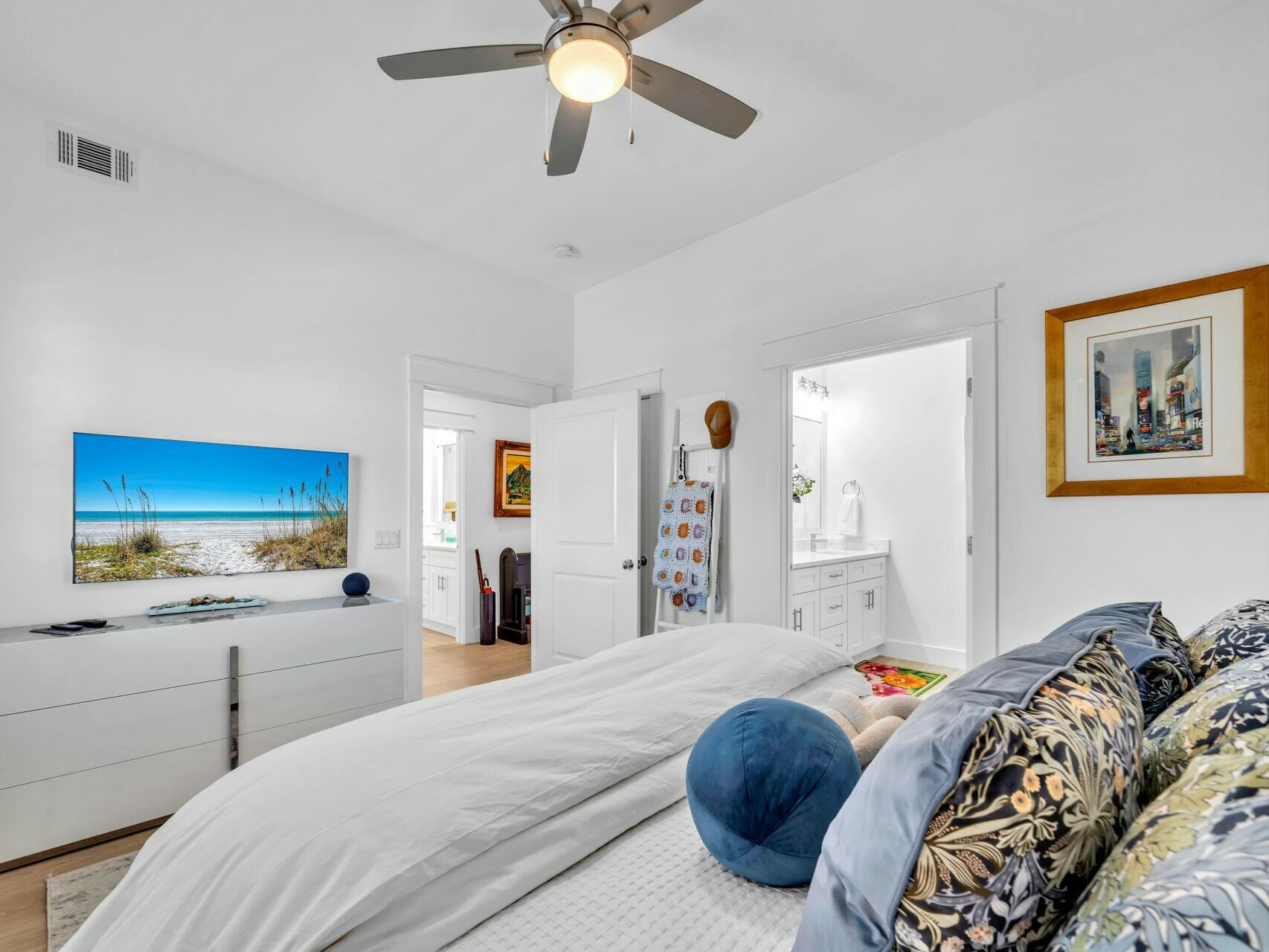 206 Henderson Resort Way, Unit 5202 Destin, FL 32541 - Photo 27 of 55 a bedroom with a large bed and a chandelier