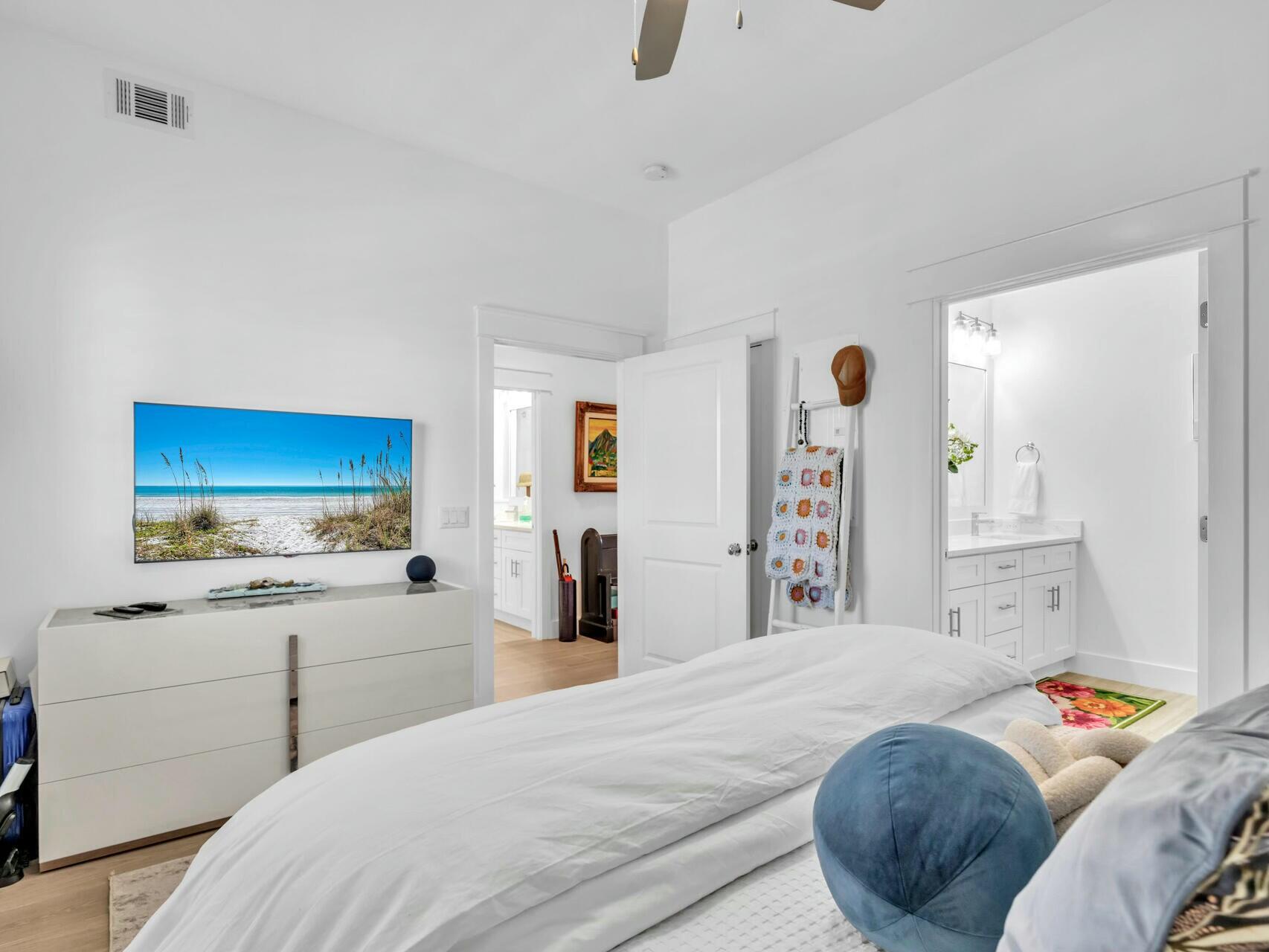 206 Henderson Resort Way, Unit 5202 Destin, FL 32541 - Photo 28 of 55 a bedroom with a bed and a large mirror on the dresser