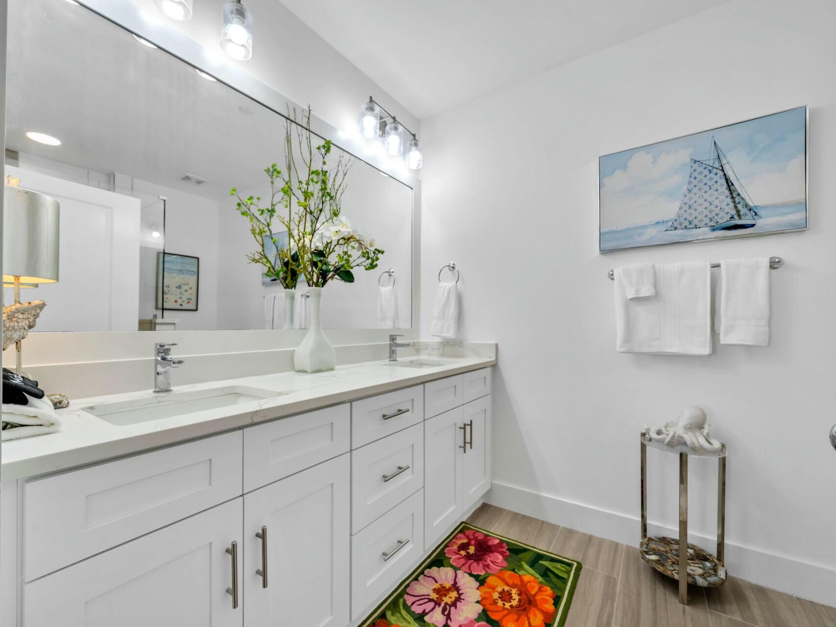 206 Henderson Resort Way, Unit 5202 Destin, FL 32541 - Photo 29 of 55 a bathroom with a double vanity sink and a mirror