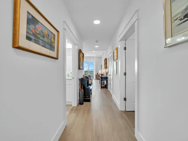 a view of a balcony with chair and potted plants