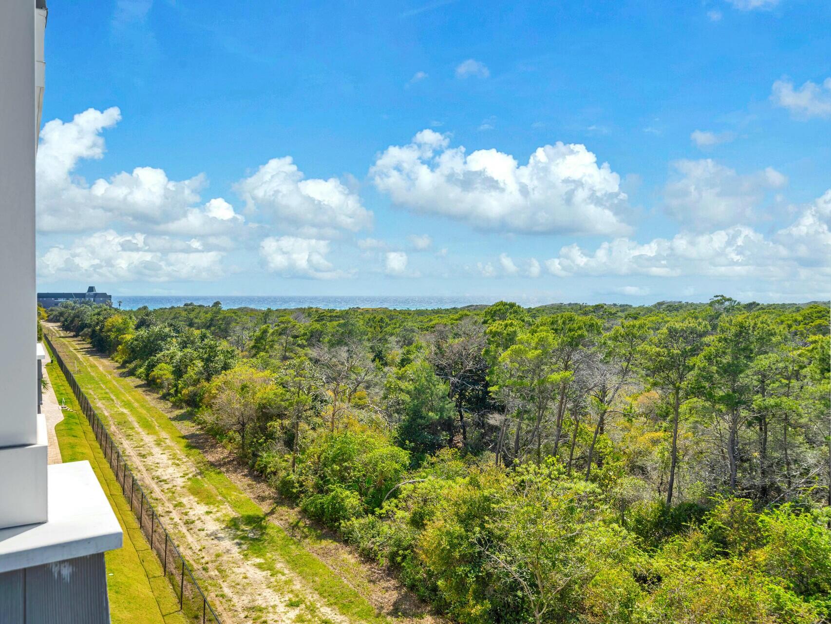 206 Henderson Resort Way, Unit 5202 Destin, FL 32541 - Photo 39 of 55 a view of a lake with a building in the background