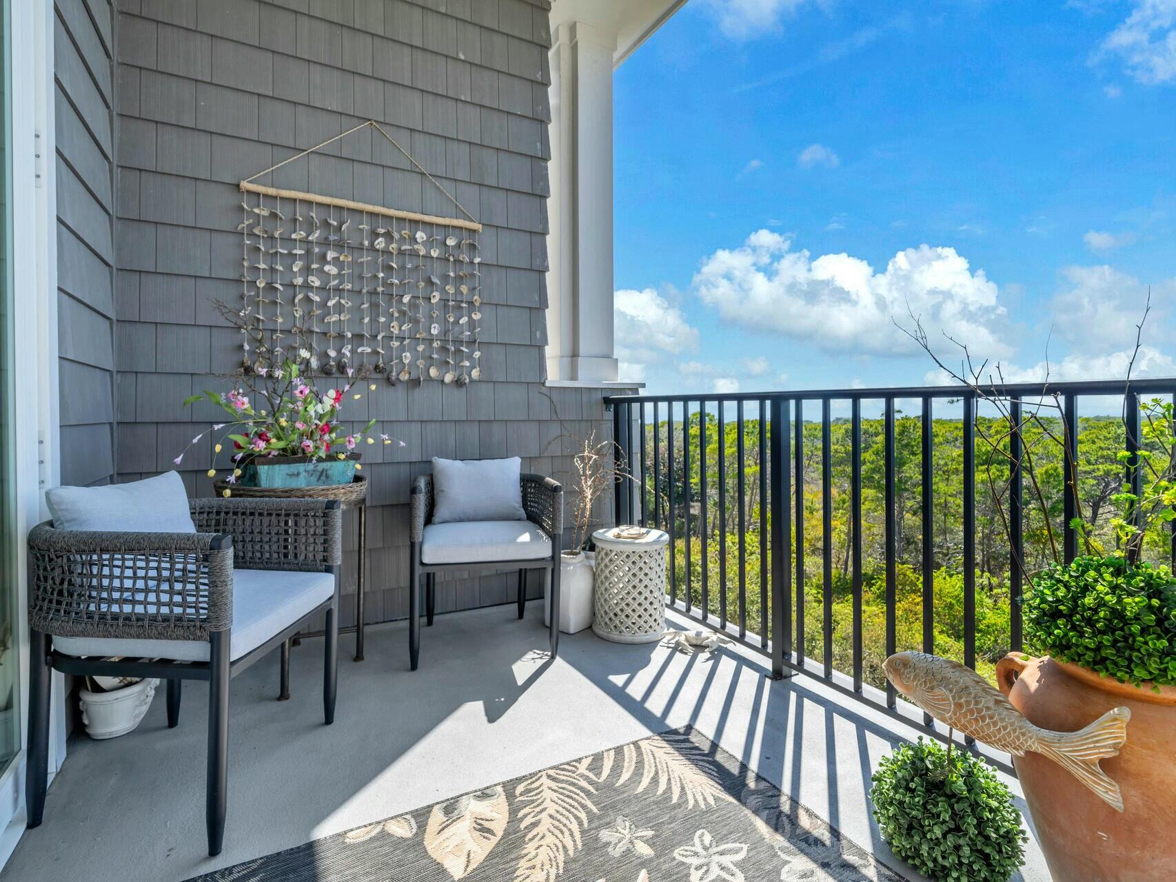 206 Henderson Resort Way, Unit 5202 Destin, FL 32541 - Photo 42 of 55 a balcony with furniture and a potted plant